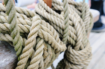 Fototapeta na wymiar Rope rigging tied up on the deck of a tall ship