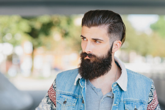 Handsome trendy bearded young Asian man