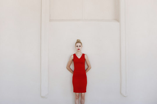 Blonde girl in a red dress
