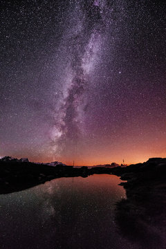 Mountain lake with galaxy