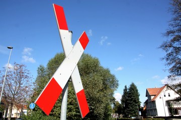 Train crossing in front of blue sky