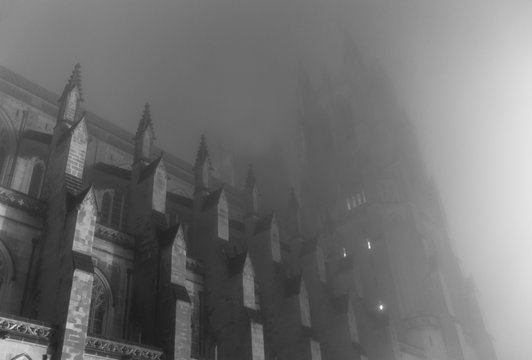 Gothic cathedral in mist on spooky night