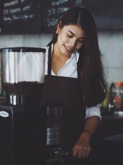Asian woman working in coffee shop cafe