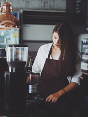 Asian woman working in coffee shop cafe