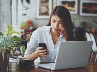 Asian business woman working in coffee shop cafe