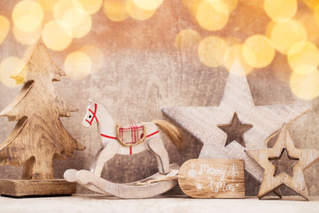 Christmas tree decorations on a wooden background. With bokeh ornaments.