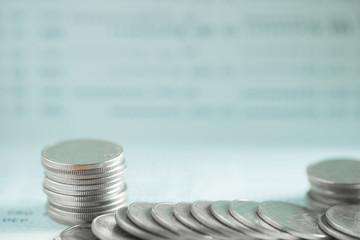 Stacks of coins and account book or credit card on working table, finance, business finance concept, shallow focus.