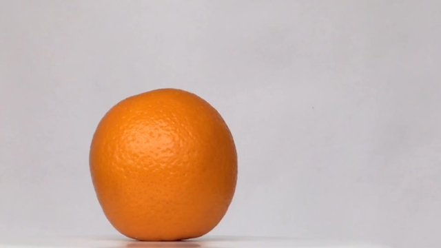 Kind of shooting rotation object: Orange fresh fruit white background orange circle motion