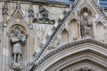stone statues carved on a cathedral wall