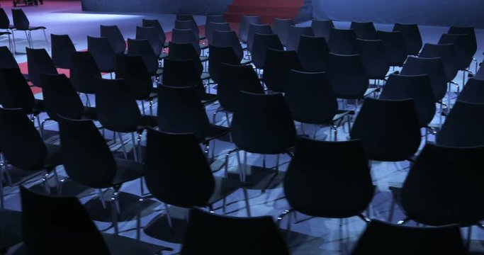 View of empty Conference hall with comfortable seats. conference room for the business audience. Free empty chairs or armchairs. In anticipation of the beginning of the seminar or lecture