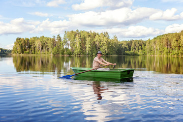 Fototapeta na wymiar A fisherman in a boat