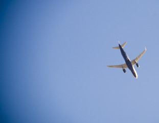 Passenger aircraft in the sky at low altitude flies to the airport to land.