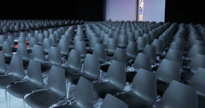 View of empty Conference hall with comfortable seats. conference room for the business audience. Free empty chairs or armchairs. In anticipation of the beginning of the seminar or lecture