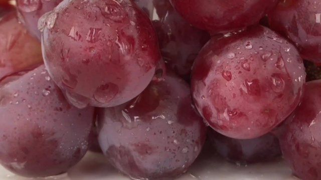 Big view: Red Grapes White background wet water droplet, authentic motion rain water droplets natural fruti deep drop water motion deep
