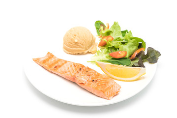 grilled salmon steak with mash potato and vegetable salad