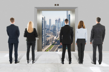 Fototapeta premium Businessman And Businesswoman Looking At Modern Elevator