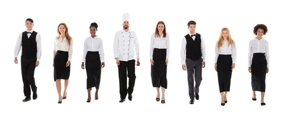 Obraz premium Restaurant Staff Walking Against White Background