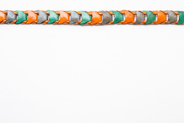 Leather knitted belt on white background