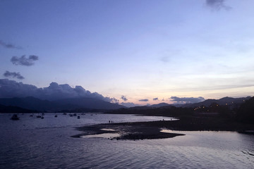 Obraz premium Horizontal mountain, blue sky, yacht boats and cloudscape on lake