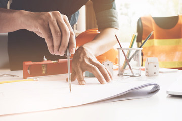 Engineer or Architect concept, Image of engineer drawing a blue print design building or house, An...