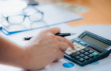 Fototapeta premium business man financial inspector and secretary making report, calculating or checking balance. Internal Revenue Service inspector checking document. Audit concept.