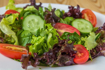 Fresh salad with mixed greens, cherry tomato and cucumber