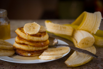 Pancakes with bananas and honey. Homemade breakfast