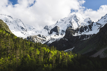 Snow mountain peaks of Caucasus mountains in cold cloudy weather, Elbrus Region. Top of Ullu-Tau mountain