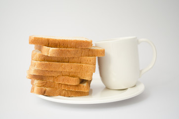 Obraz na płótnie Canvas Bread and white cup