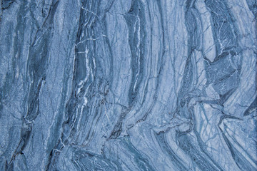 The pattern and surface of the blue, white and black marble walls for the background and tile design.