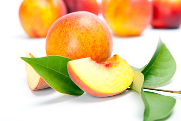 fresh whole peaches with cut, isolated on white background