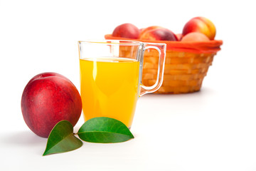 Peach fruit juice in glass isolated on white background