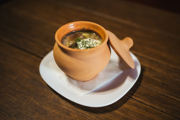 Mushroom soup in a clay pot