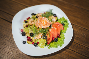 Vegetable salad with salmon and shrimp