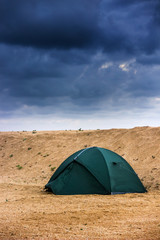 green tent at the beach
