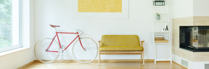 Bicycle next to sofa