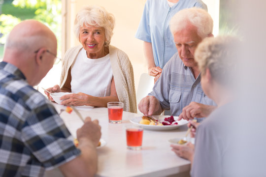 Pensioners eating lunch