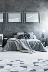 Grey bedroom with geometric carpet