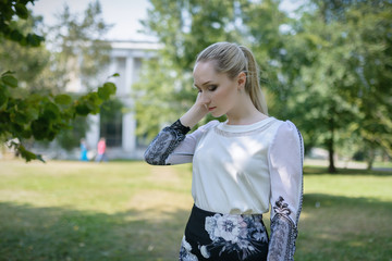 Fototapeta premium Outdoors portrait of beautiful young woman. Selective focus.