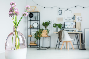 Violet flowers in work area