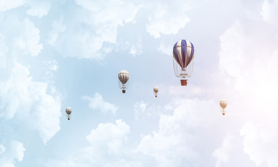 Flying hot air balloons in the air.