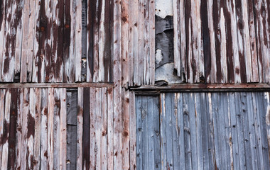 Background of old wooden board with cracked red paint