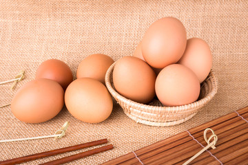 Set Eggs in a basket on  gunny (sackcloth)  background