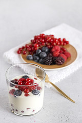 Yogurt with berries, cranberries and raspberries
