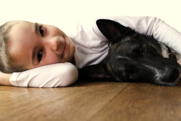 Obraz premium Little boy with dog isolated on white