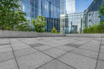 Fototapeta premium empty brick floor front of modern buildings