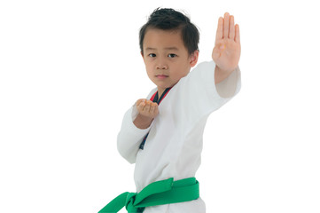 Asian boy wearing white Taekwondo suit acting ready to battle, Isolated on white background.
