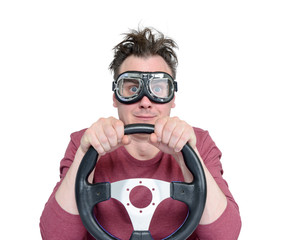 Man in stylish goggles with steering wheel, isolated on white background. Car driver concept