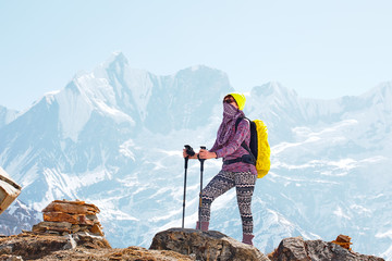 Girl on the background of mountain peaks
