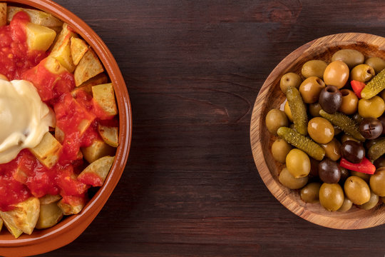 Patatas bravas and olives, Spanish tapas with copy space